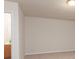 Bedroom with neutral walls and carpet offers an attached bathroom through a doorway at 10548 English Setter Way, Charlotte, NC 28269