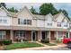 Two-story townhome boasts brick front, inviting porch area, and well-kept landscaping at 10548 English Setter Way, Charlotte, NC 28269
