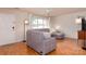 Bright living room showcases plush sectional couch and large windows at 10548 English Setter Way, Charlotte, NC 28269
