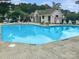 Community pool featuring lounge chairs and tables on the deck area at 10548 English Setter Way, Charlotte, NC 28269
