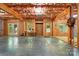 Unfinished basement space offering exposed ceiling, framing, concrete floor and light filled windows at 10607 Newberry Park Ln, Charlotte, NC 28277