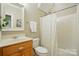 Functional bathroom with tub-shower combo, single sink vanity, and neutral wall color at 10607 Newberry Park Ln, Charlotte, NC 28277