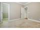 Bedroom with carpet flooring and views of a walk in closet and ensuite bathroom at 10607 Newberry Park Ln, Charlotte, NC 28277