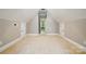 Large finished bonus room with a vaulted ceiling, carpet flooring, and access to storage areas at 10607 Newberry Park Ln, Charlotte, NC 28277