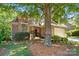 Charming brick home with a well-manicured lawn and mature trees at 10607 Newberry Park Ln, Charlotte, NC 28277