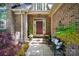 Inviting front porch with brick accents and stylish outdoor seating at 10607 Newberry Park Ln, Charlotte, NC 28277