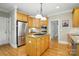 Efficient kitchen featuring stainless steel appliances, ample cabinet space, and a convenient center island at 10607 Newberry Park Ln, Charlotte, NC 28277