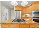 Charming kitchen featuring stainless appliances, gas cooktop, and granite countertops, ideal for cooking at 10607 Newberry Park Ln, Charlotte, NC 28277