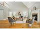 Spacious living room with fireplace, hardwood floors and lots of natural light at 10607 Newberry Park Ln, Charlotte, NC 28277