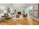 Bright living room with vaulted ceilings, fireplace, and hardwood floors at 10607 Newberry Park Ln, Charlotte, NC 28277