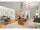 Bright living room featuring hardwood floors, high ceilings, and an open floor plan for easy entertaining at 10607 Newberry Park Ln, Charlotte, NC 28277