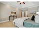 Spacious main bedroom with a tray ceiling, modern decor, and access to ensuite bathroom at 10607 Newberry Park Ln, Charlotte, NC 28277