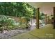 Outdoor patio space with brick accents, plants, and room for patio furniture at 10607 Newberry Park Ln, Charlotte, NC 28277