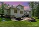 Backyard featuring a patio with comfortable seating, a built-in fire pit, and an expansive green lawn at 10874 Rise Ln, Fort Mill, SC 29707