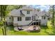 Backyard featuring a patio with comfortable seating, a built-in fire pit, and an expansive green lawn at 10874 Rise Ln, Fort Mill, SC 29707