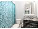 Bathroom featuring a toilet and black vanity with granite countertop and a mirror at 10874 Rise Ln, Fort Mill, SC 29707