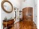 Spacious foyer featuring hardwood floors, elegant doors, and stylish decor at 10874 Rise Ln, Fort Mill, SC 29707