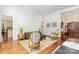 Spacious living room with hardwood floors, ample seating, and sophisticated décor at 10874 Rise Ln, Fort Mill, SC 29707