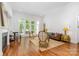 Bright living room with large windows, hardwood floors, and elegant seating at 10874 Rise Ln, Fort Mill, SC 29707