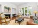 Elegant living room with fireplace, large windows, and sophisticated furnishings at 10874 Rise Ln, Fort Mill, SC 29707