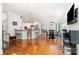 Open-concept living space featuring a kitchen with white cabinets and an adjacent dining area with ample natural light at 10874 Rise Ln, Fort Mill, SC 29707