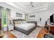 Spacious main bedroom with natural light, hardwood floors, and a comfortable seating area at 10874 Rise Ln, Fort Mill, SC 29707