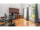 Bright office area with natural light from large windows and built-in wooden desk and storage at 10874 Rise Ln, Fort Mill, SC 29707