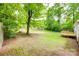 Lush backyard with deck and plenty of room for activities, surrounded by trees at 110 Eighth St, York, SC 29745