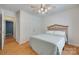 Bright bedroom with wood floors, a ceiling fan, and natural light streaming in from the exterior at 110 Eighth St, York, SC 29745