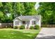 Charming home with well-maintained lawn, decorative shutters and front porch at 110 Eighth St, York, SC 29745
