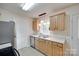 Charming kitchen featuring stainless steel appliances, wooden cabinets and a view of the exterior landscape at 110 Eighth St, York, SC 29745