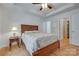 Comfortable main bedroom featuring a ceiling fan, wood floors, and easy access to the closet at 110 Eighth St, York, SC 29745