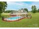 Aerial shot showcasing a home with a sprawling backyard, deck, and in-ground pool in a serene setting at 112 Ocean Dr, Shelby, NC 28152