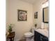 Charming powder room with floral decor, dark vanity, and a framed mirror over the sink at 112 Ocean Dr, Shelby, NC 28152