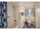 Accessible bathroom with a shower/tub combo, safety bars, and neutral decor at 112 Ocean Dr, Shelby, NC 28152