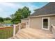 Spacious deck with wooden railings, offering views of the pool and backyard at 112 Ocean Dr, Shelby, NC 28152