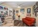 Cozy den with built-in bookshelves, a comfortable recliner, and a love seat with wood flooring at 112 Ocean Dr, Shelby, NC 28152