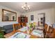 Dining room features wainscoting, wood table, seating for six, and a large window at 112 Ocean Dr, Shelby, NC 28152