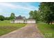 Lovely home featuring a two-car garage, a pool, and a well-manicured lawn at 112 Ocean Dr, Shelby, NC 28152