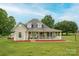 Charming home with a large front porch, green shutters, dormer windows, and a spacious lawn at 112 Ocean Dr, Shelby, NC 28152