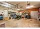 This garage features pegboard walls, shelving, and garage door openers at 112 Ocean Dr, Shelby, NC 28152