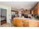 Kitchen featuring wood cabinets, stainless steel appliances, breakfast bar, and tile flooring at 112 Ocean Dr, Shelby, NC 28152