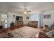 Inviting living room with hardwood floors, ceiling fan, and comfortable furnishings under warm lighting at 112 Ocean Dr, Shelby, NC 28152