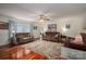Spacious living room with hardwood floors, comfortable seating, and a decorative area rug at 112 Ocean Dr, Shelby, NC 28152