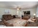 Open-concept living room with wood floors, multiple sofas, and a large area rug under soft lighting at 112 Ocean Dr, Shelby, NC 28152