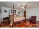 This main bedroom offers hardwood floors, a four-poster bed, and natural light at 112 Ocean Dr, Shelby, NC 28152
