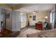 Bright office area with a wooden desk, chair, and open access to adjacent rooms at 112 Ocean Dr, Shelby, NC 28152