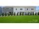 Spacious backyard featuring lush green grass, privacy landscaping, and a serene outdoor living space at 1229 Margo Mannor Dr, Fort Mill, SC 29708