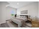 Serene bedroom with a plush bed, neutral decor, and a large window with a view at 1229 Margo Mannor Dr, Fort Mill, SC 29708