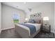 Comfortable bedroom with a full-sized bed, bedside tables, and ample natural light from the window at 1229 Margo Mannor Dr, Fort Mill, SC 29708